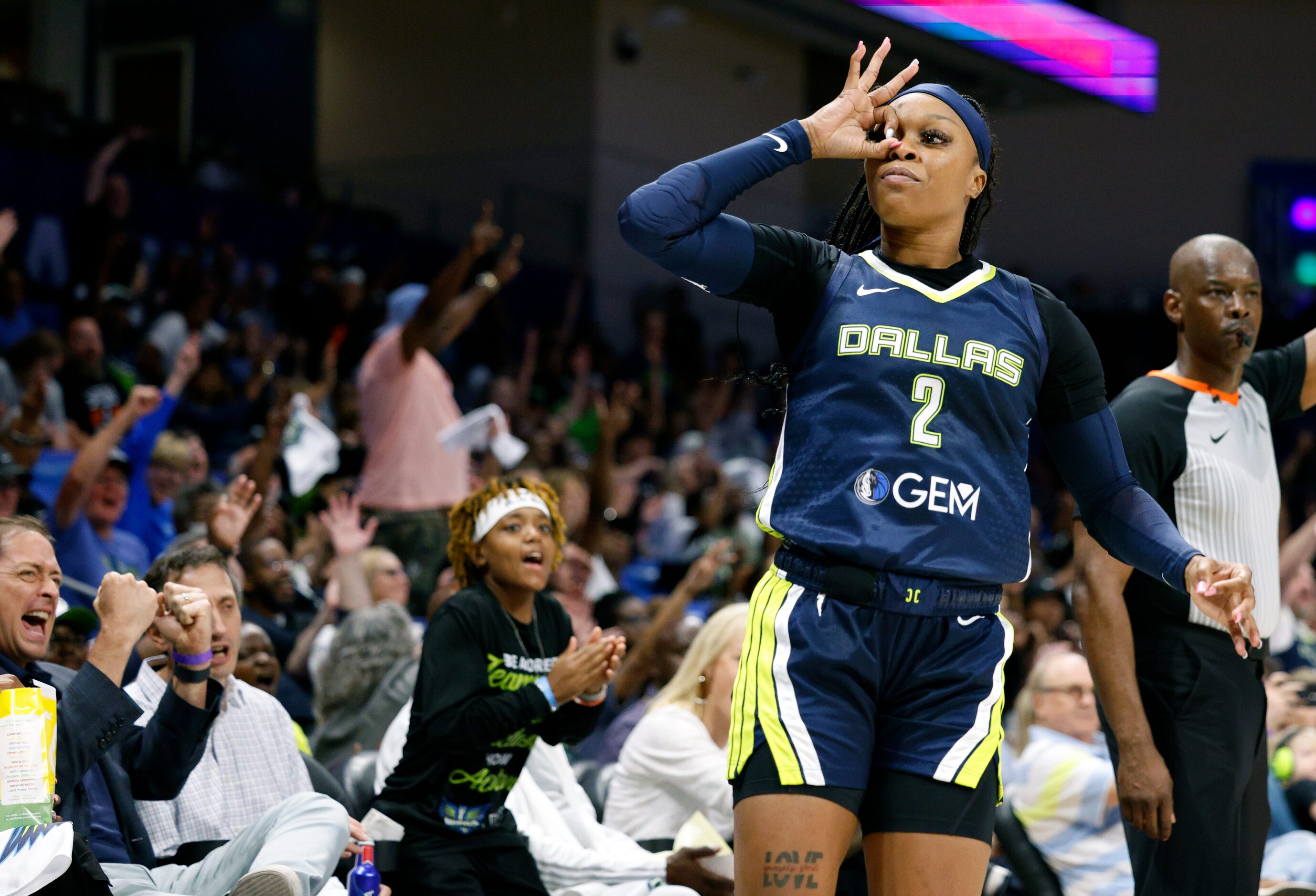 Dallas Wings guard Odyssey Sims (2) celebrates a three-point shot during the second half of...