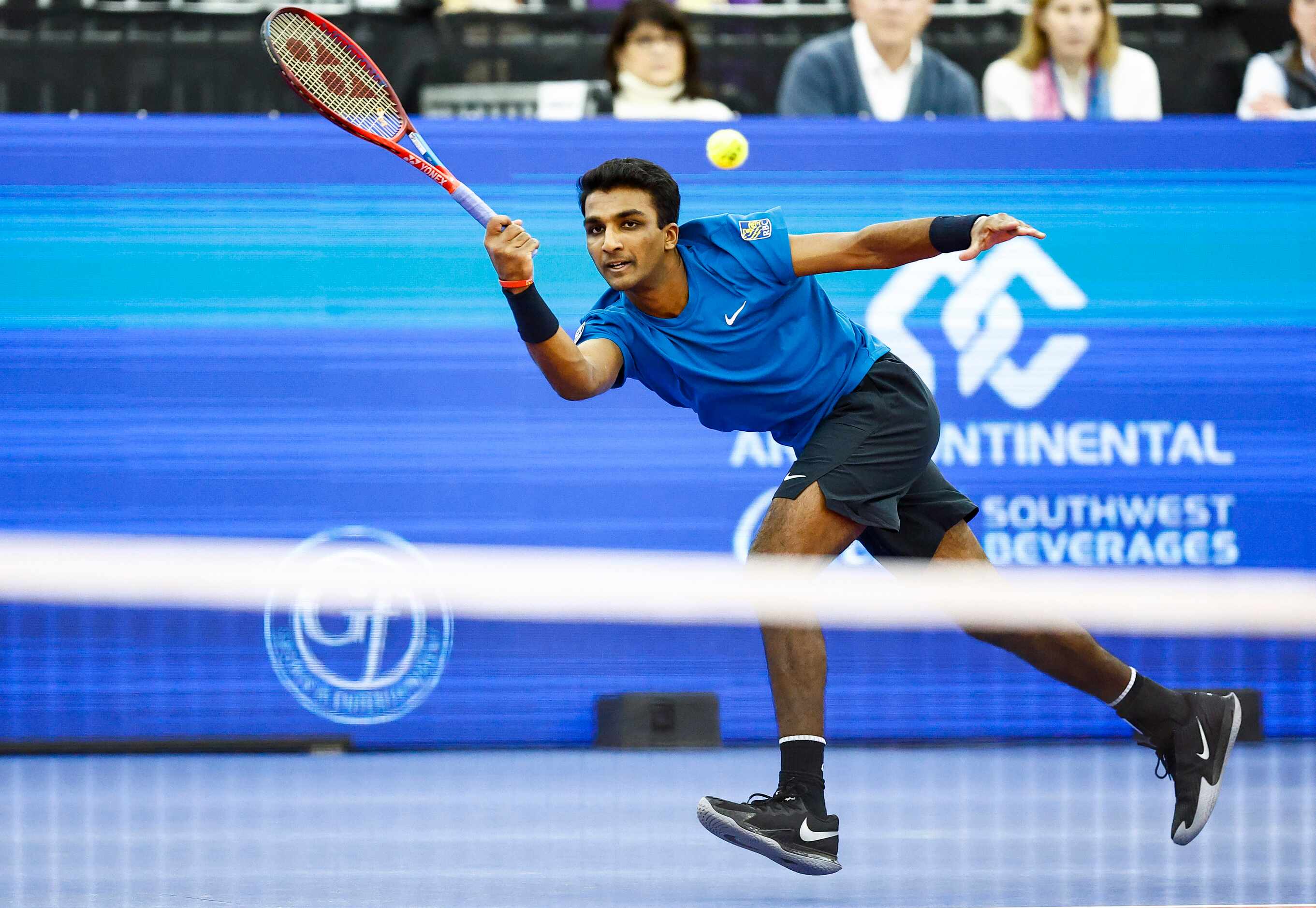 SMU senior Caleb Chakravarthi returns the ball in a match against Vasek Pospisil during the...