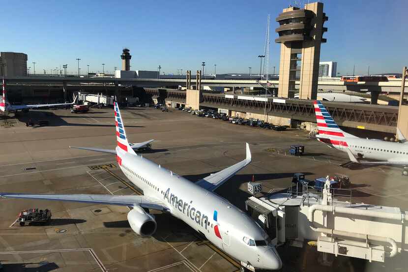 (FILES) This file photo taken on October 17, 2017 shows an American Airlines plane at the...