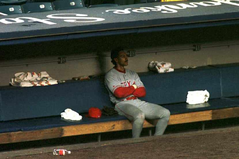  October 2, 1996--Texas' Juan Gonzalez sits alone dejectedly in the Rangers dugout after the...