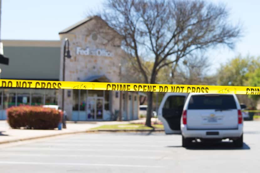 Police and FBI Agents investigate at the Sunset Valley FedEx store located on Brodie Lane in...
