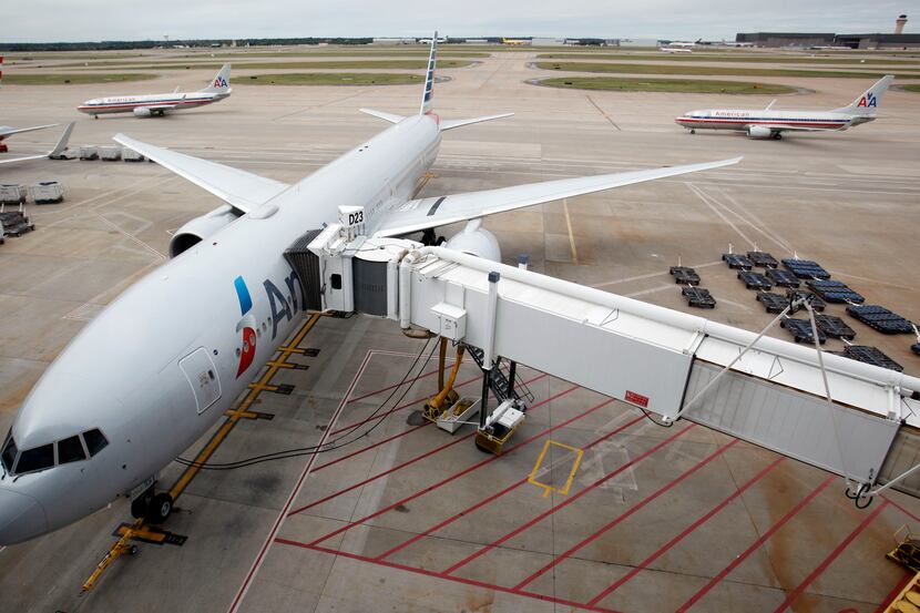 An American Airlines 777 on display outside Terminal D at DFW International Airport in...