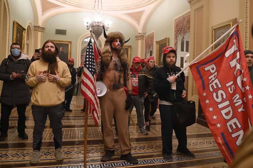Supporters of President Donald Trump enter the US Capitol on January 6, 2021, after...