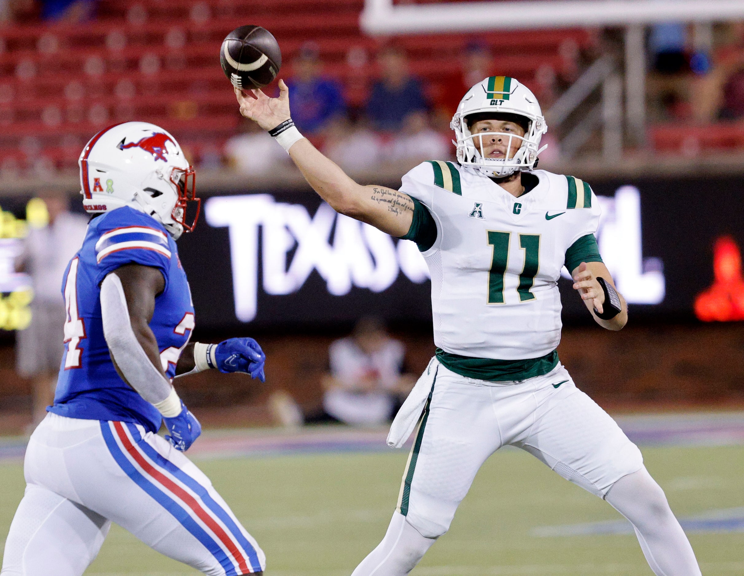 Charlotte 49ers quarterback Trexler Ivey (11) passes under pressure from SMU linebacker Kobe...