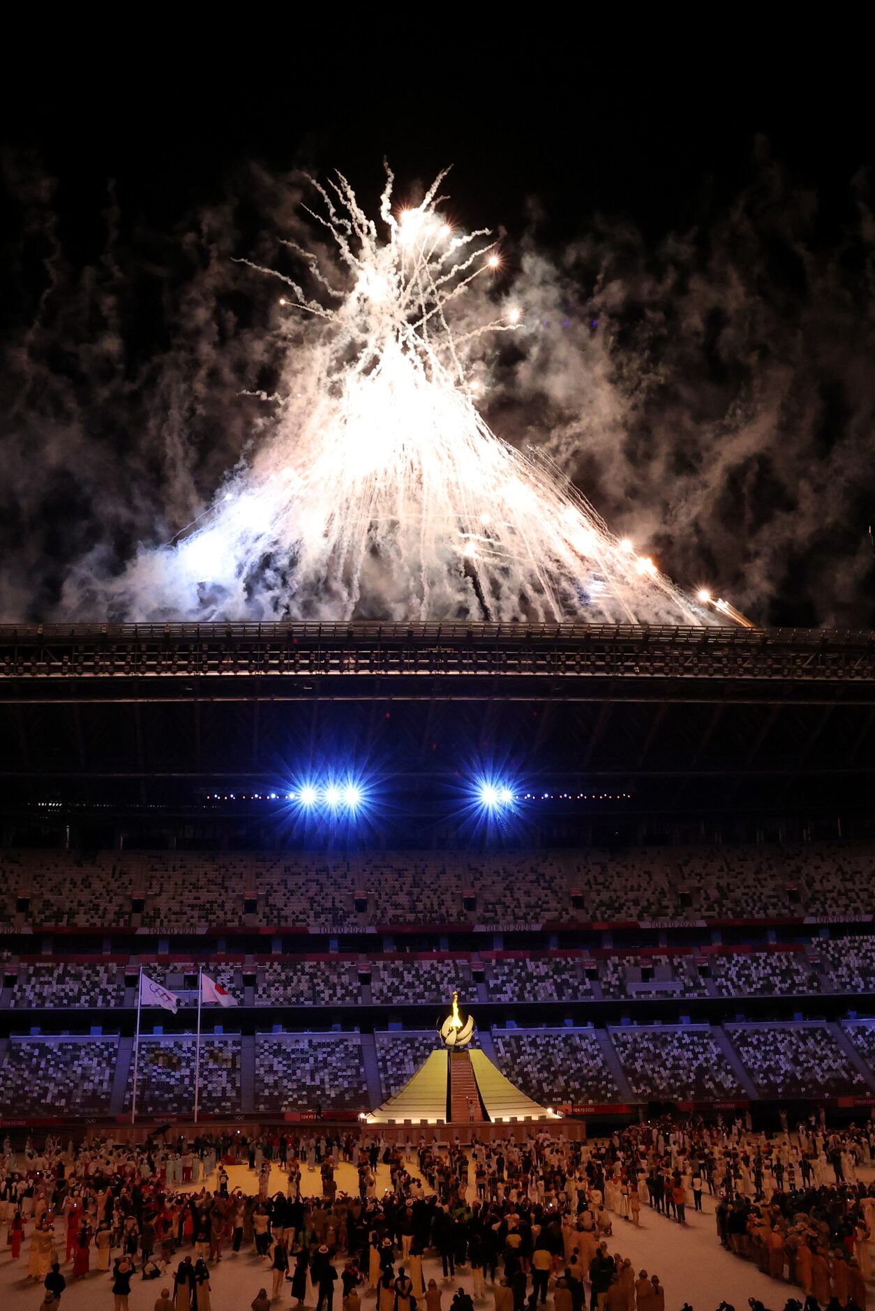 Fireworks go off after the Olympic cauldron was lit during the opening ceremony for the...