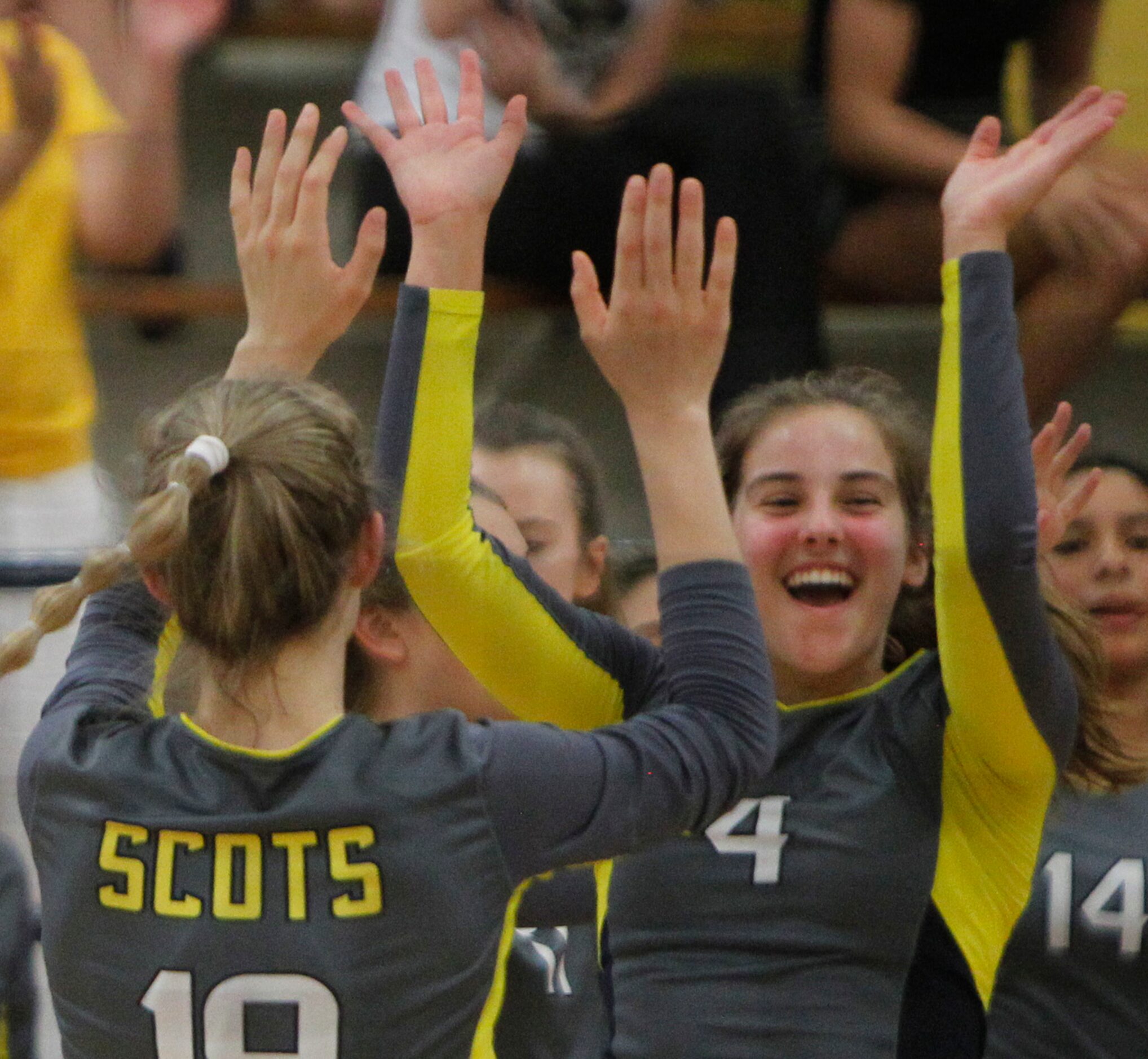 Highland Park Scots teammates Maren Hamilton (4), right, and Emily Hellmuth (19) exchange...