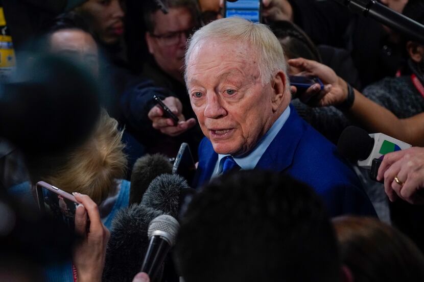 Dallas Cowboys owner Jerry Jones speaks to reporters following an NFL football game between...