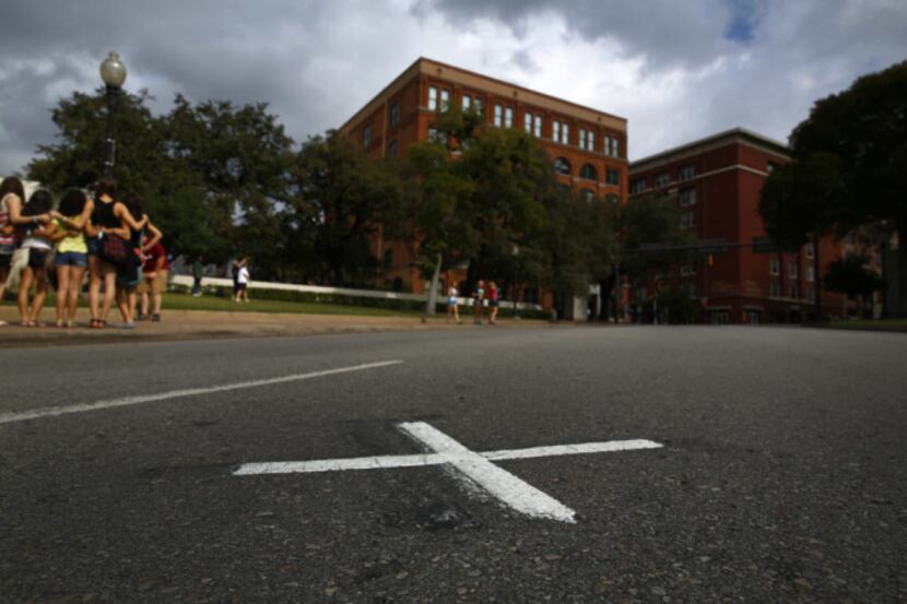 An X on Elm Street marks the spot where President John F. Kennedy was shot on Nov. 22, 1963....