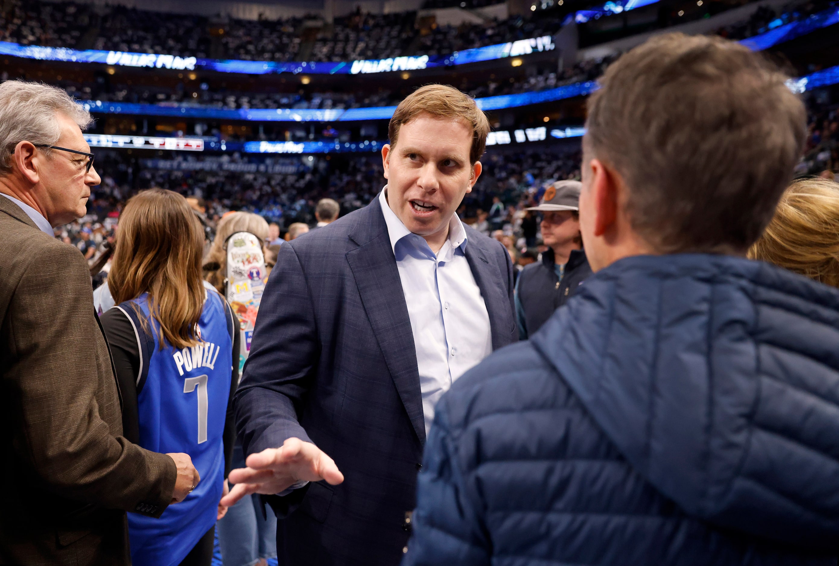 Dallas Mavericks new governor and majority owner Patrick Dumont (center) visits with fans...