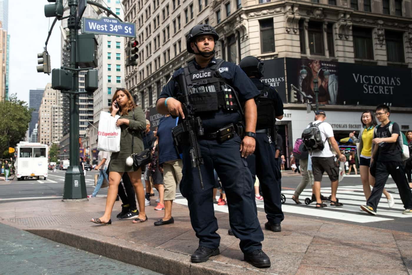 A member of the New York City Police Department stands guard in Herald Square, September 18,...