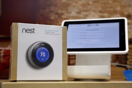 The Nest Thermostat is on display at Best Buy in Dallas, Thursday, February 20, 2014. (Tom...