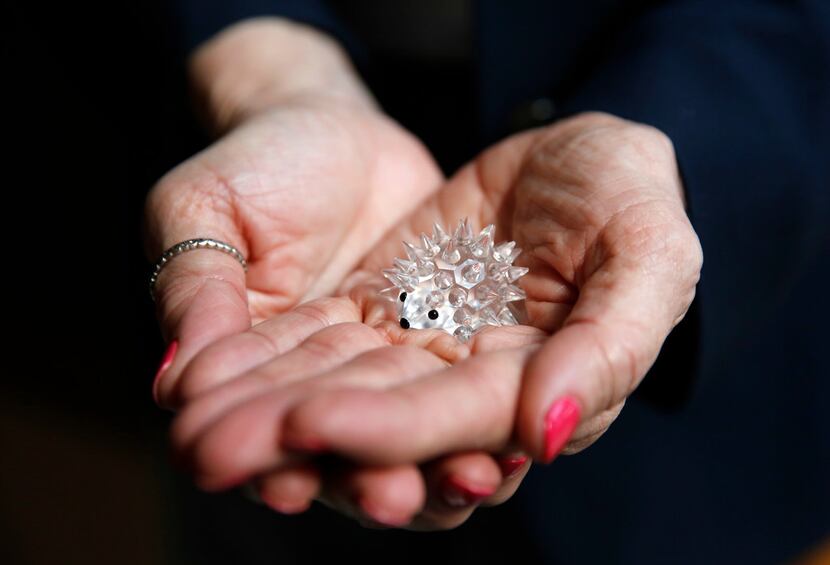 Attorney Charla Aldous holds a glass porcupine figurine that Isabella Fletcher brought her a...