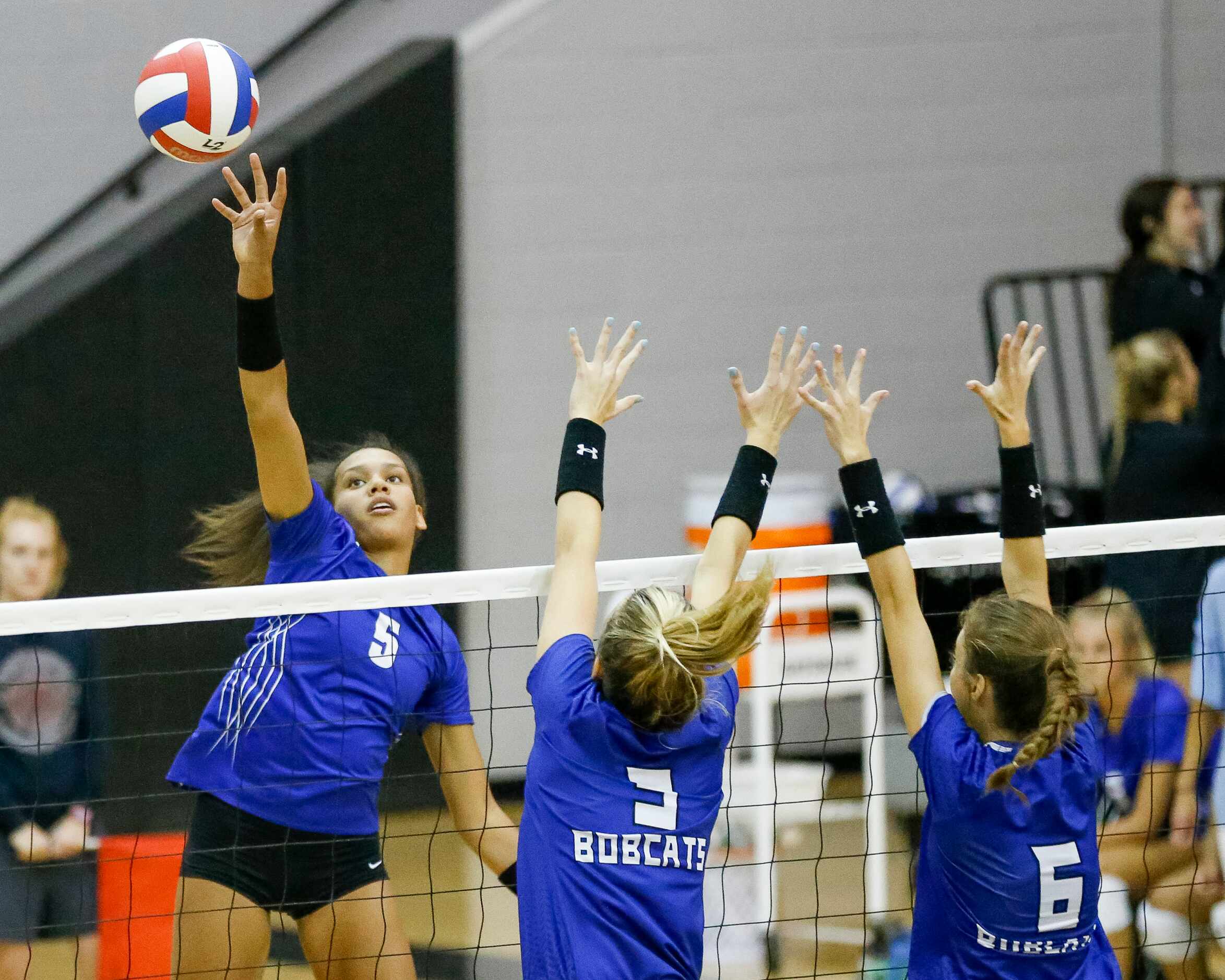 Denton Guyer outside hitter Kyndal Stowers (5) hits over Trophy Club Byron Nelson outside...
