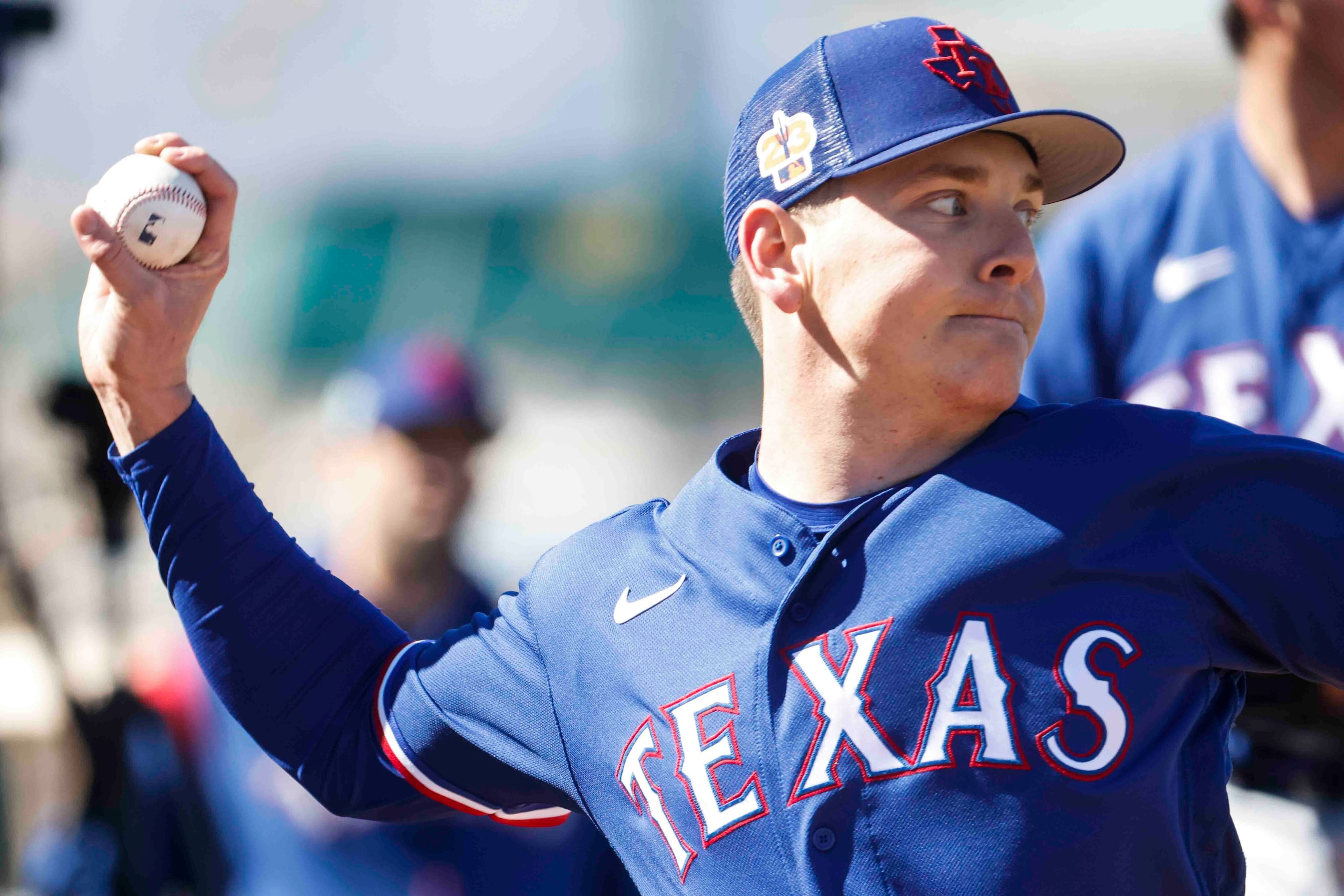 Texas Rangers right handed pitcher Spencer Howard practices during the first spring training...