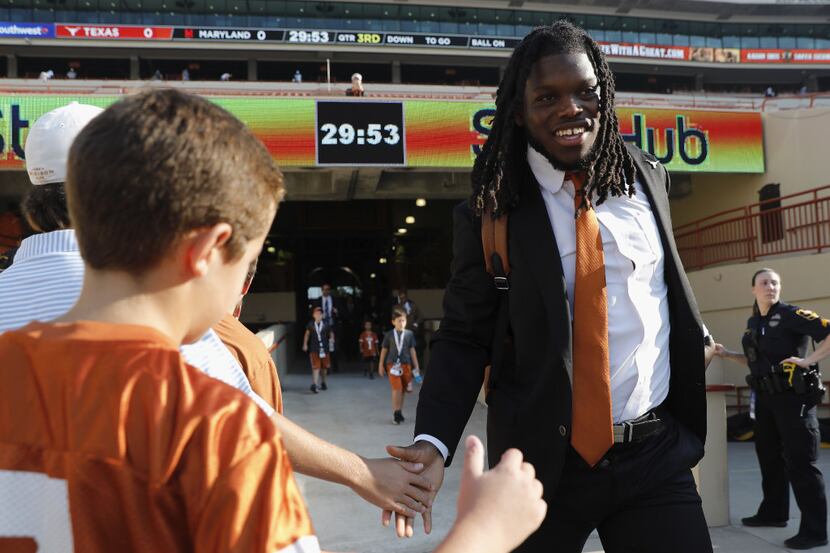 AUSTIN, TX - SEPTEMBER 02:  Malik Jefferson #46 of the Texas Longhorns shakes hands with...