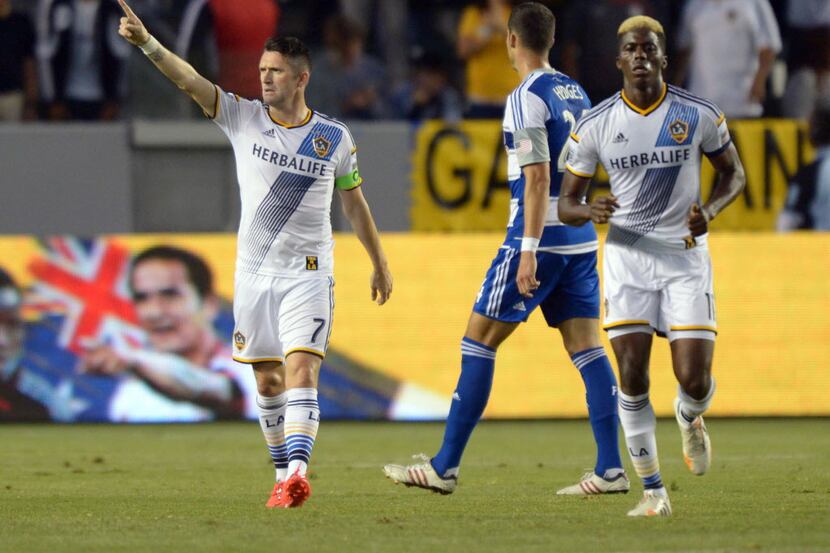 May 21, 2014; Carson, CA, USA; Los Angeles Galaxy forward Robbie Keane (7) celebrates with...