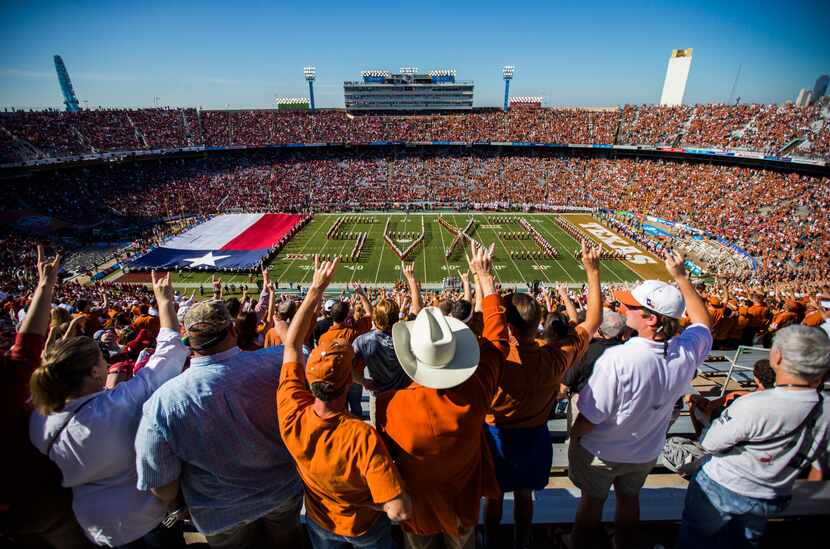 Texas Longhorns fans hookem as the Texas Longhorns band takes the field before the 2016 AT&T...