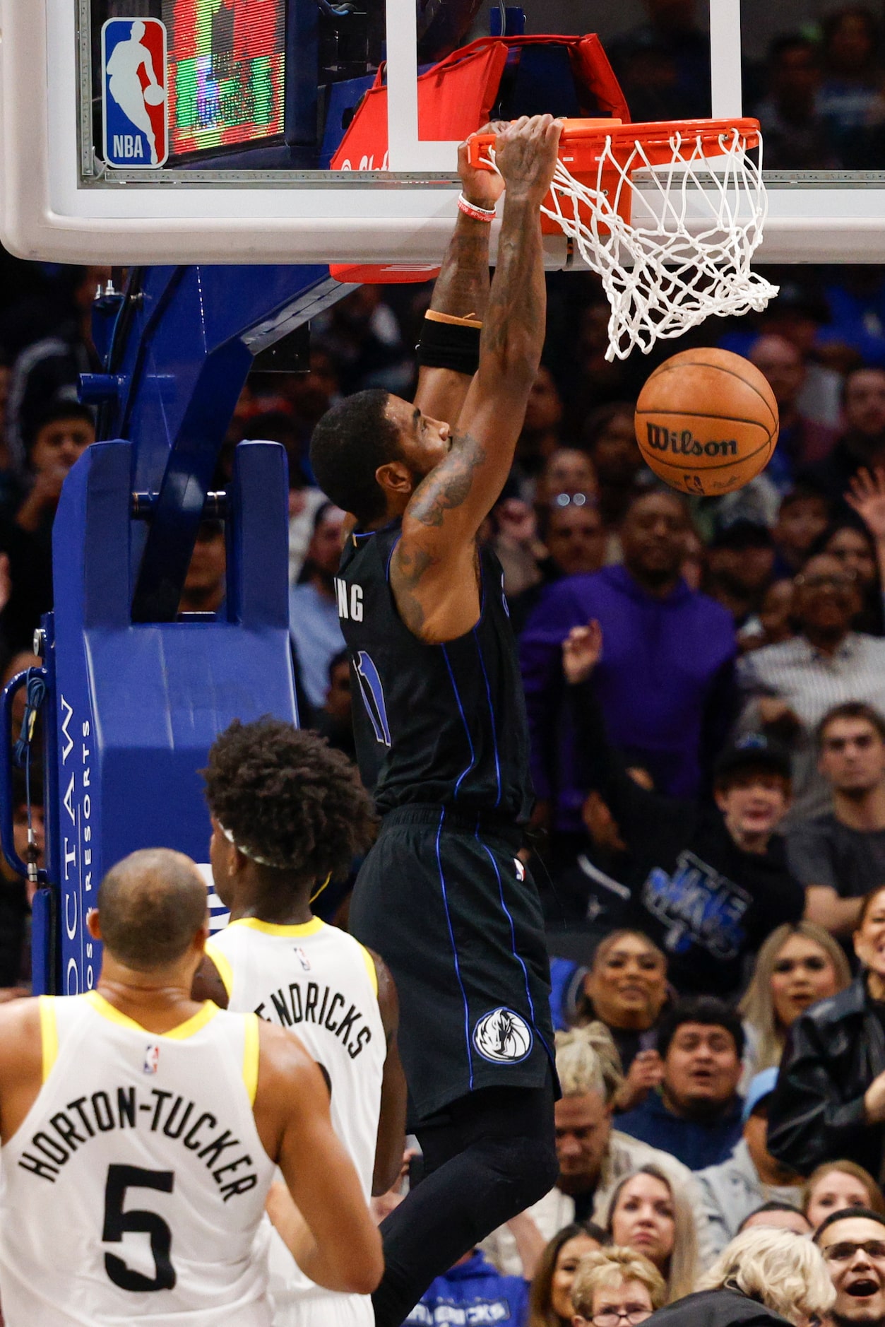 Dallas Mavericks guard Kyrie Irving (11) dunks the ball over Utah Jazz forward Taylor...