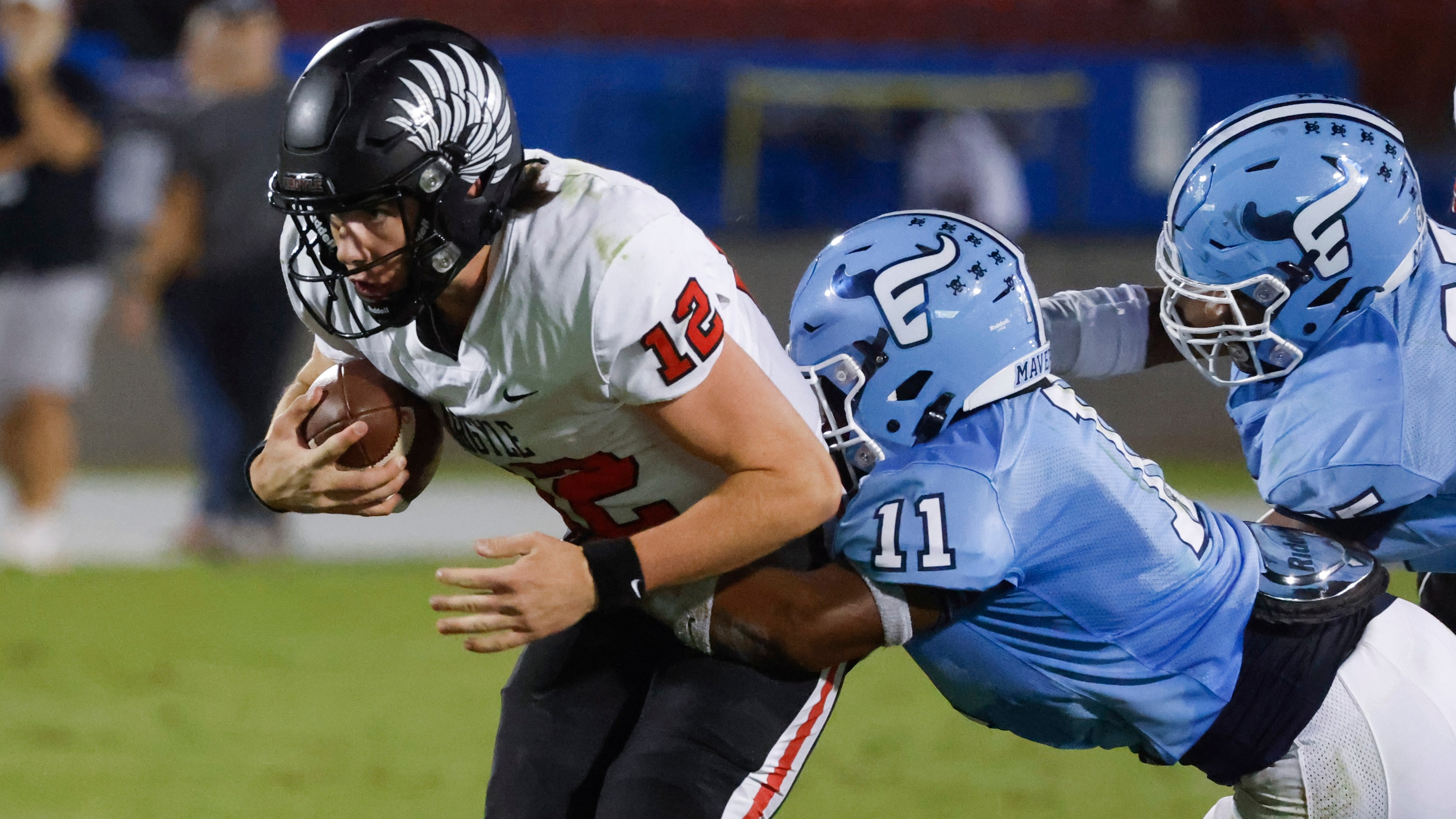 Argyle’s John Gailey (12) gets tackled by Emerson’s Agape Lawrence (11) during the first...