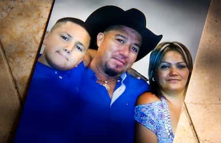 In an undated photo, 14 year-old John Zuniga (left) is picture with his parents Osvaldo and...