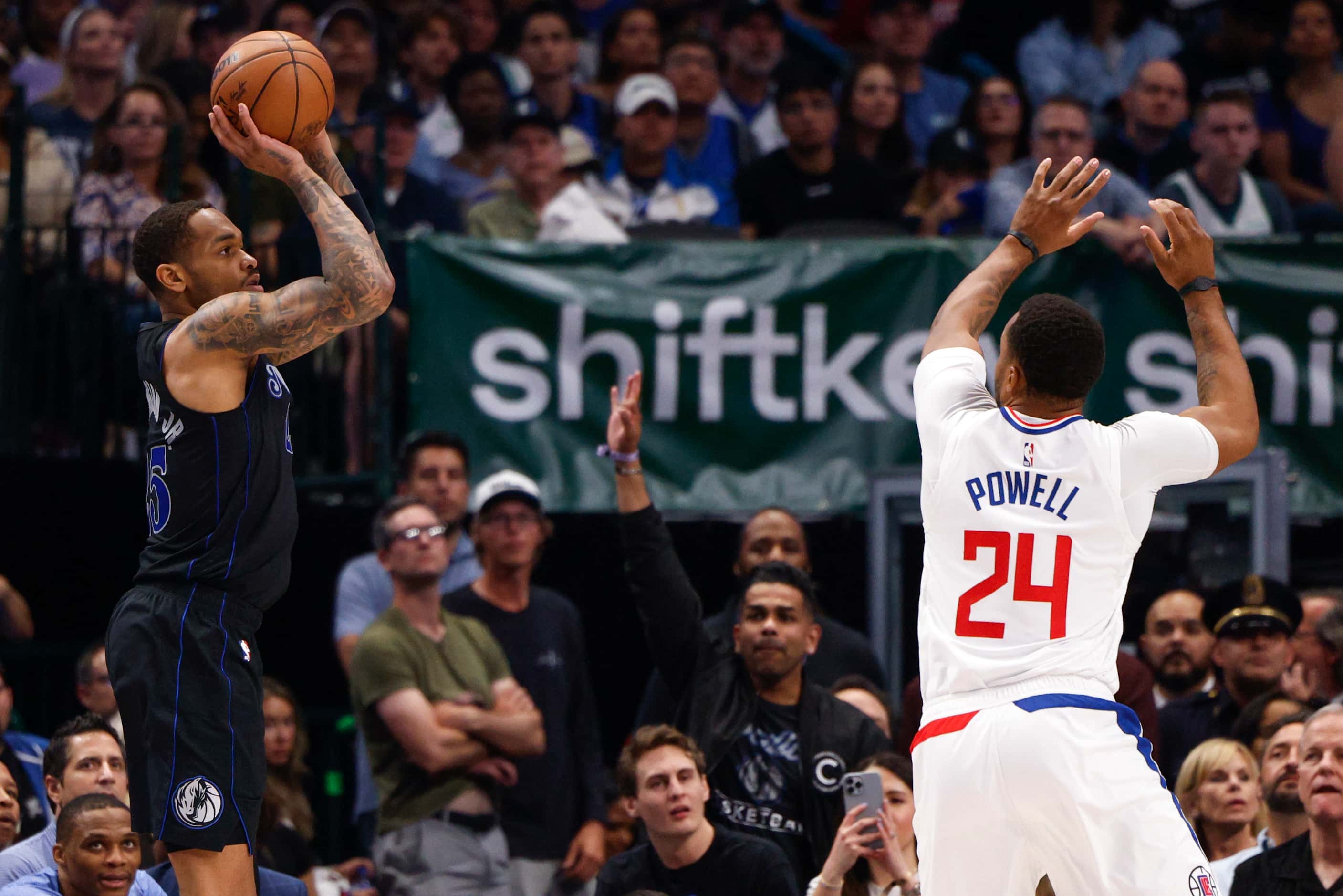 Dallas Mavericks forward P.J. Washington (25) shoots a three-pointer over LA Clippers guard...