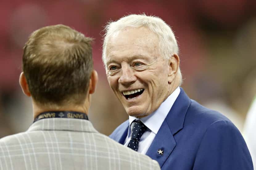 Dallas Cowboys owner Jerry Jones talks with a gentleman before their game against the New...