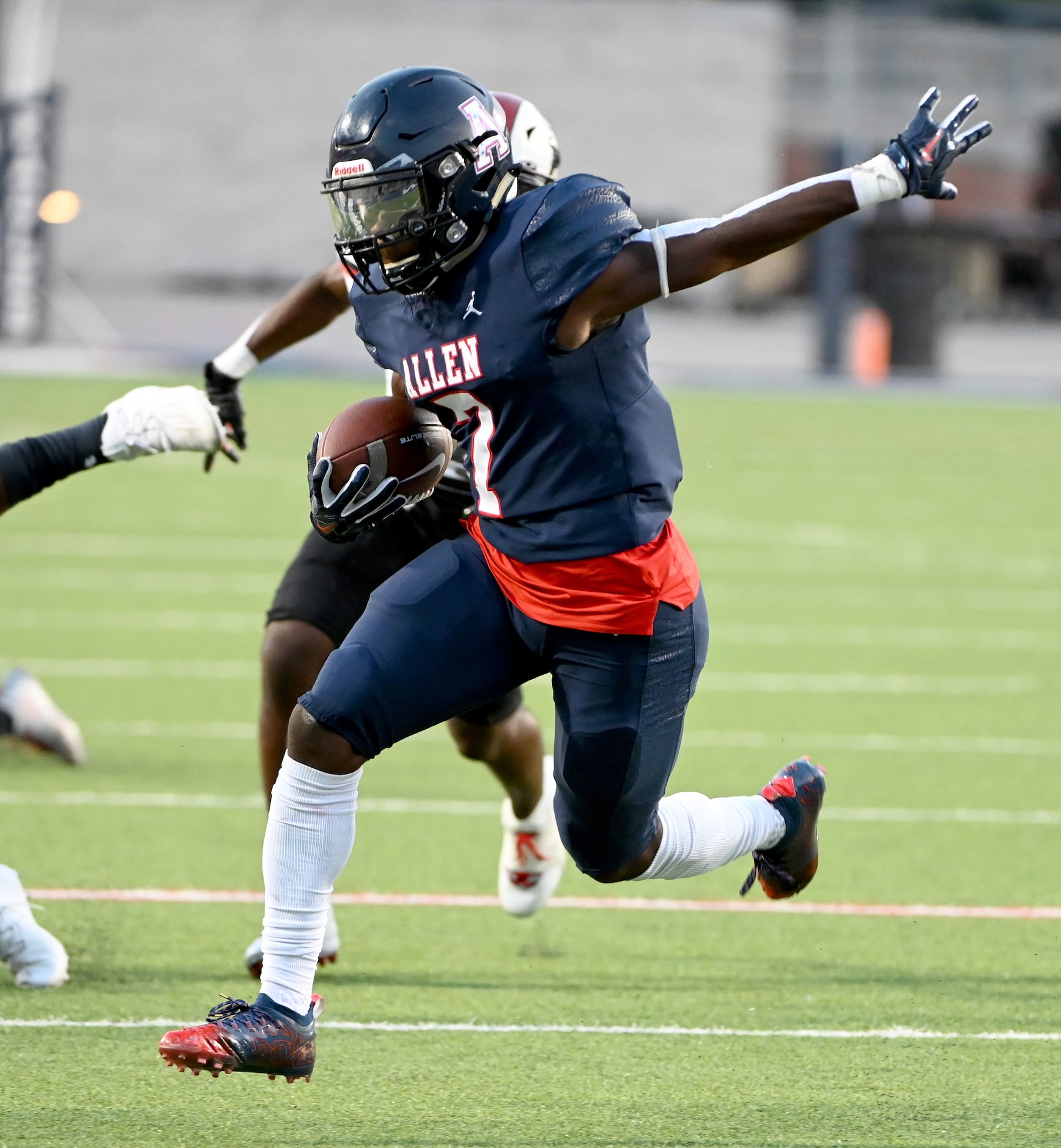 Allen's Kayvion Sibley (7) runs upfield in the first half of a high school football game...