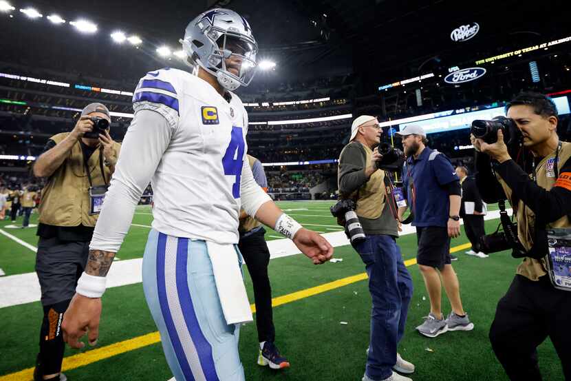 Dallas Cowboys quarterback Dak Prescott (4) walks to the locker room following their Wild...