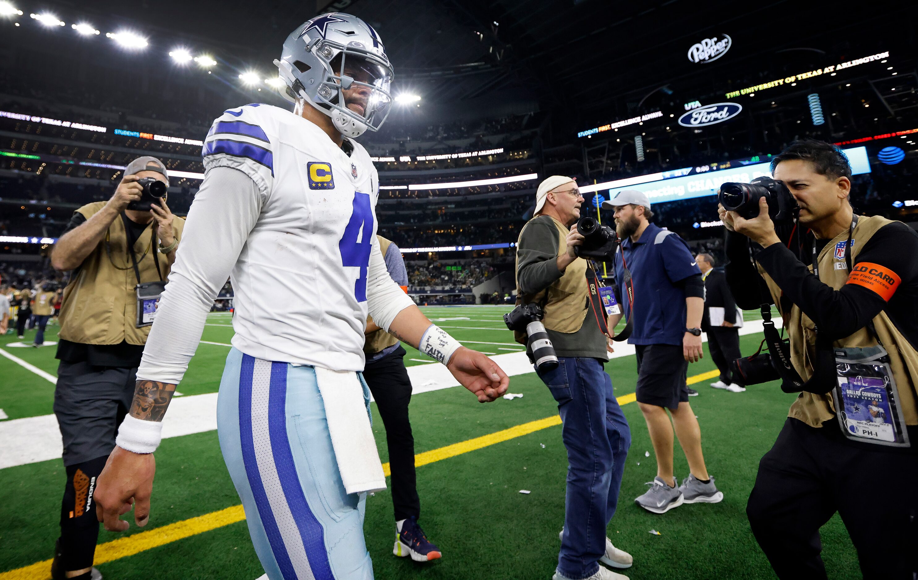 Dallas Cowboys quarterback Dak Prescott (4) walks to the locker room following their Wild...