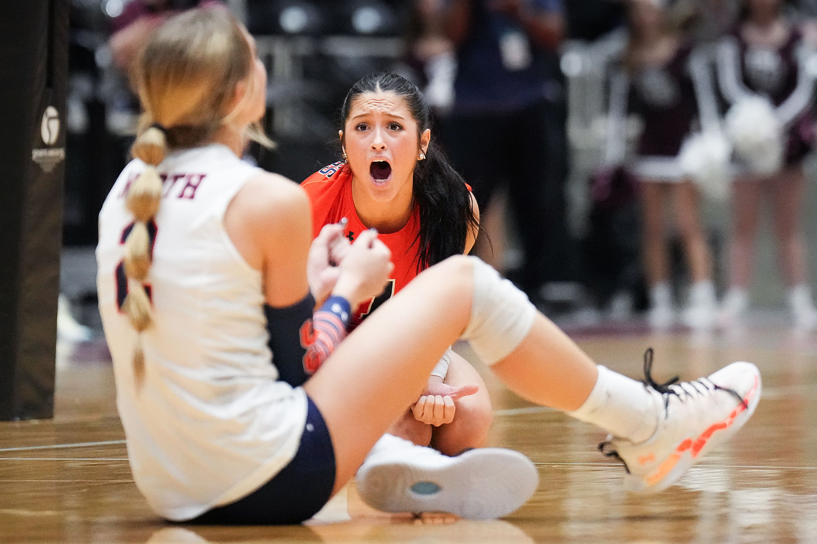 McKinney North's Gabi Rodriguez (facing) celebrates a play by Allyn Brewer (2) during the...