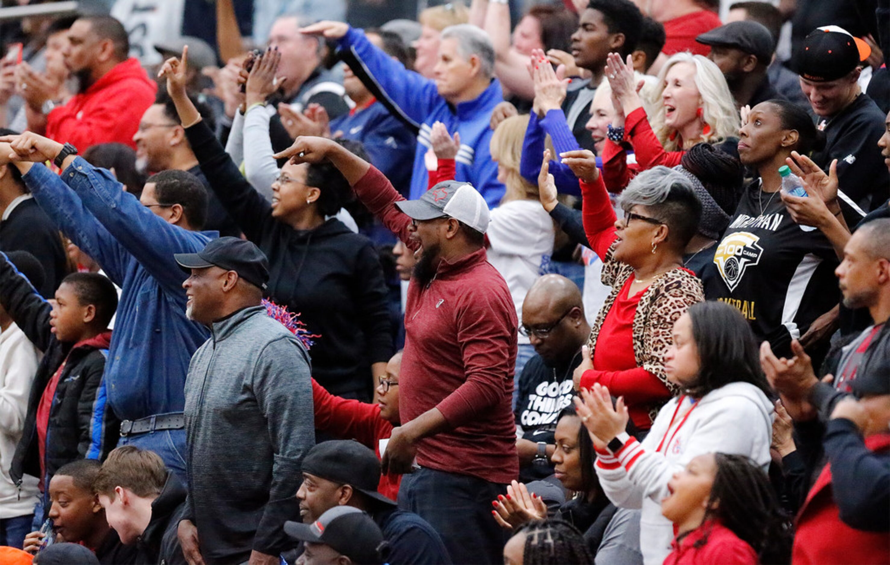 South Garland fans celebrate a basket during the first half as South Garland High School...