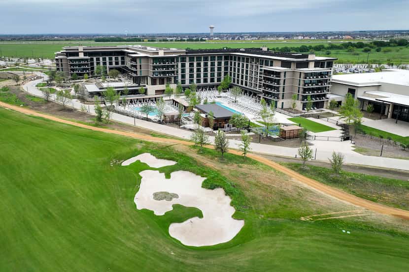 An aerial view of the Fields Ranch West golf course with the Omni PGA Frisco Resort at PGA...