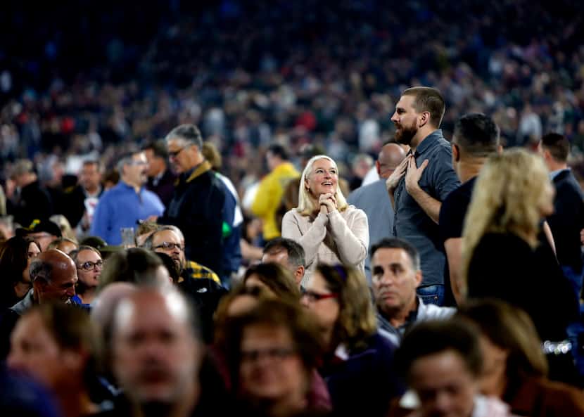 Prior to Billy Joel hitting the stage, fans socialize among a capacity crowd. Billy Joel...