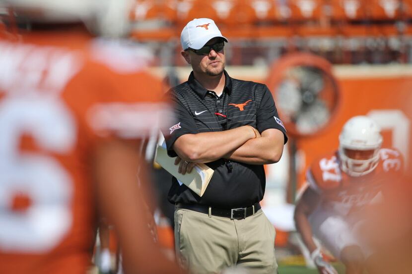 Longhorns head coach Tom Herman is pictured during pregame warmups during the University of...