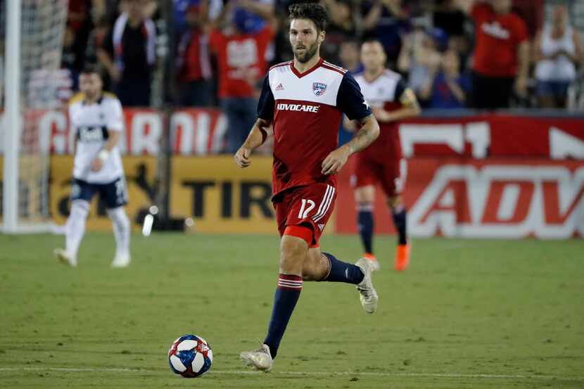 FC Dallas defender Ryan Hollingshead handles the ball during an MLS soccer match against the...