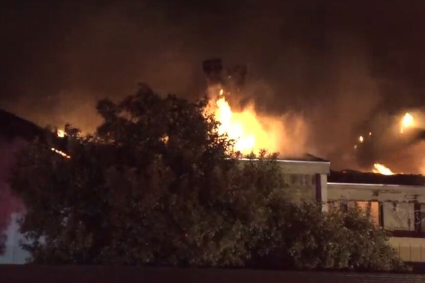 Fire quickly spread to the roof of a condominium complex in Lake Highlands on Monday night.