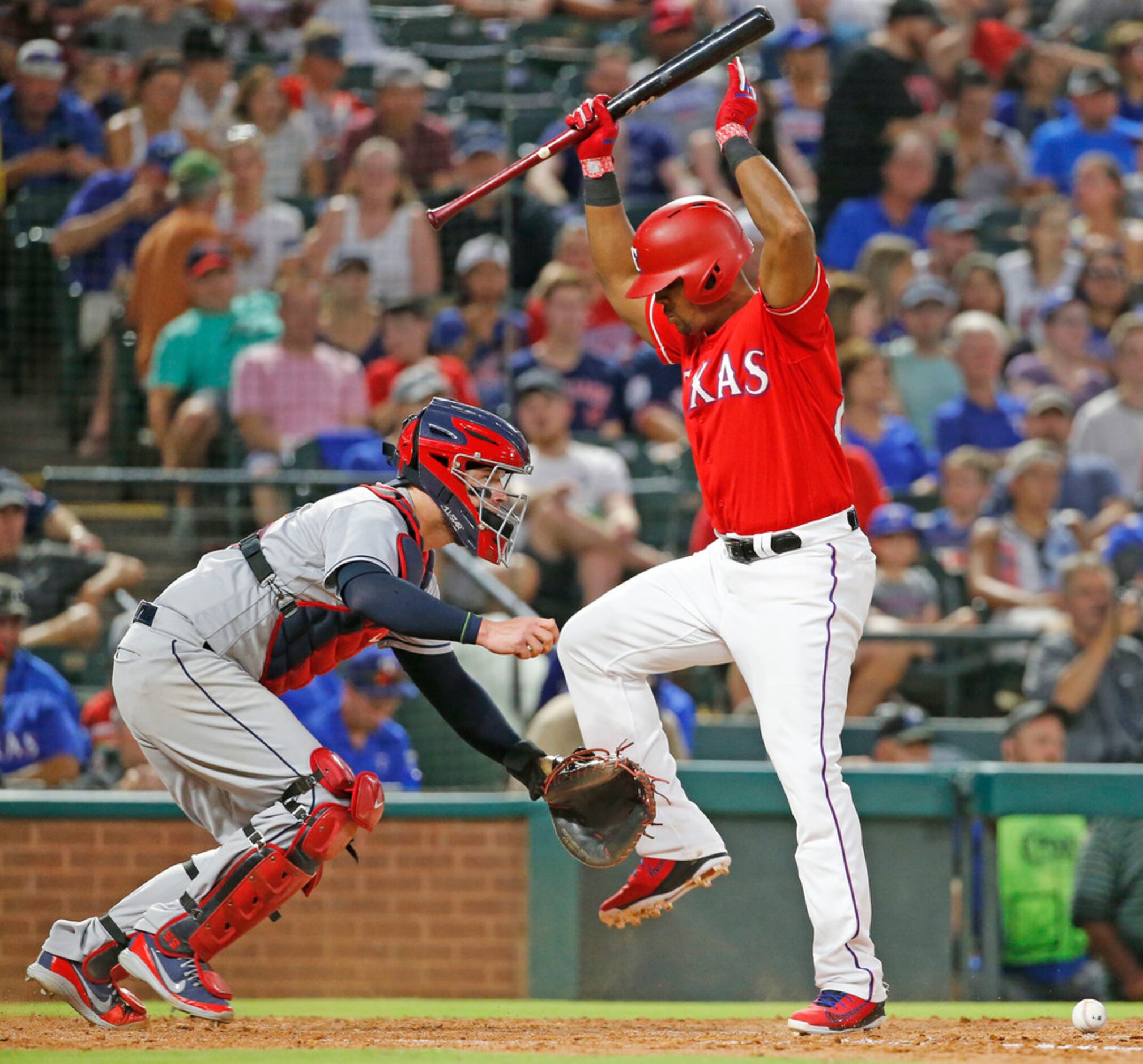 Texas Rangers third baseman Adrian Beltre (29) dances out of the way as Cleveland Indians...