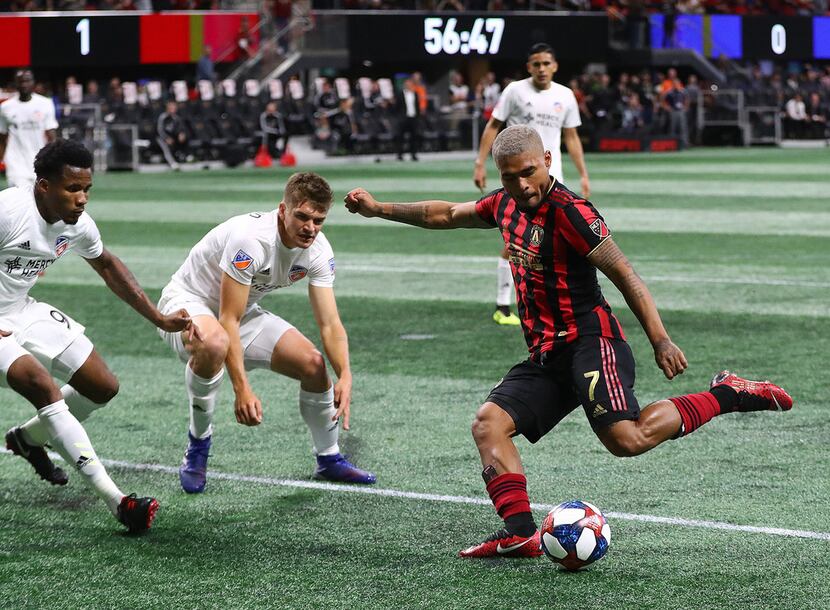 Atlanta United midfielder Josef Martinez takes a shot on goal, which is blocked by FC...
