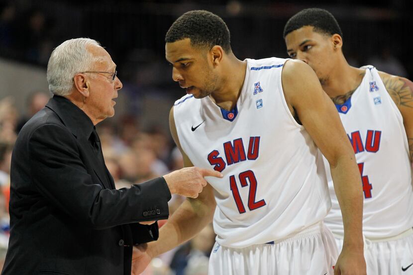 SMU's coach Larry Brown talks to Nick Russell (12) in their against Louisville during the...