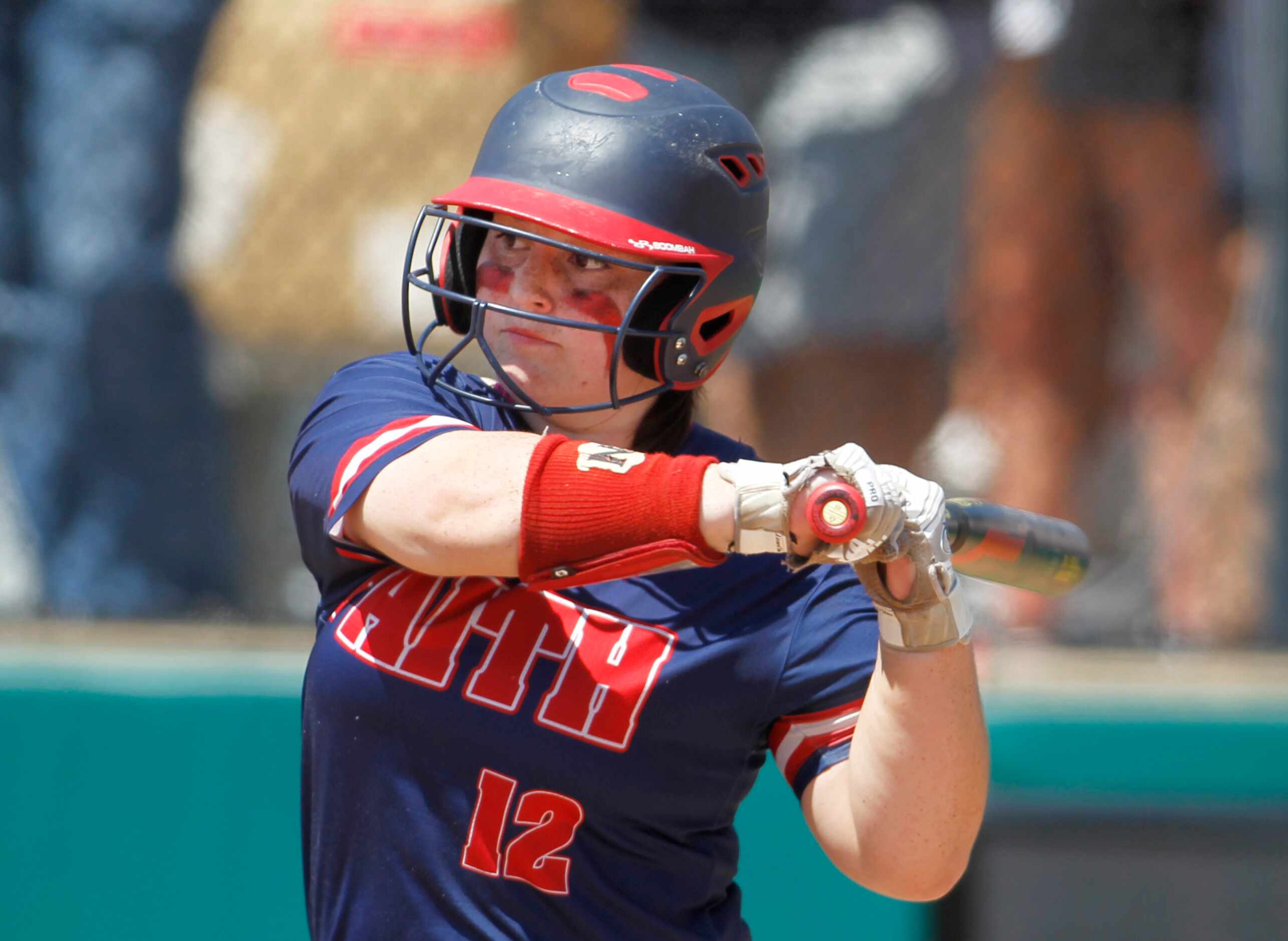 Grapevine Faith Christian's Ellen Estridge (12) holds up on a pitch while batting in the top...