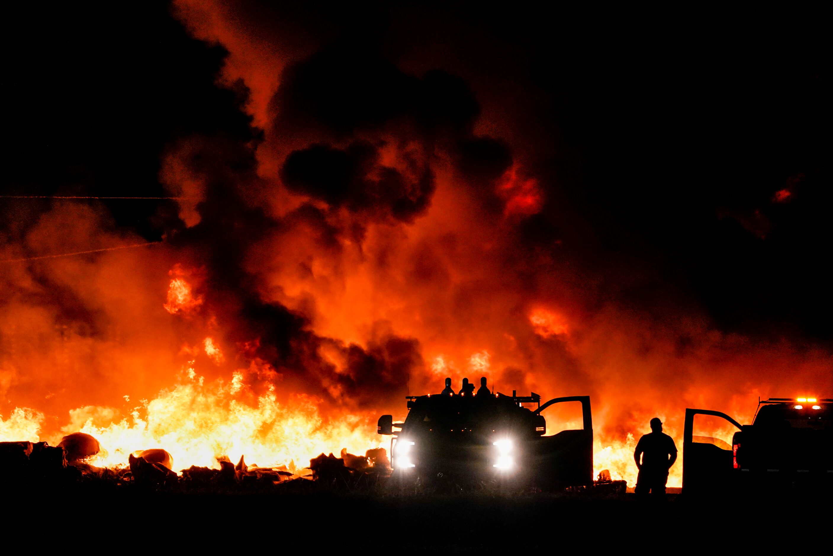 Fire crews battle a massive blaze in an industrial area of Grand Prairie in the early...