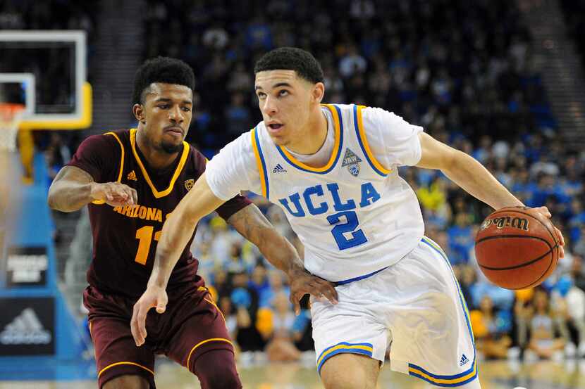 UCLA guard Lonzo Ball (2) drives on Arizona State's Shannon Evans II (11) during an NCAA...