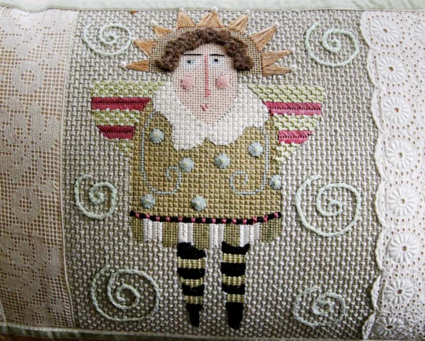 Needlepoint pillows stitched by Sally Vaughn will be part of an upcoming exhibit at Thistle...