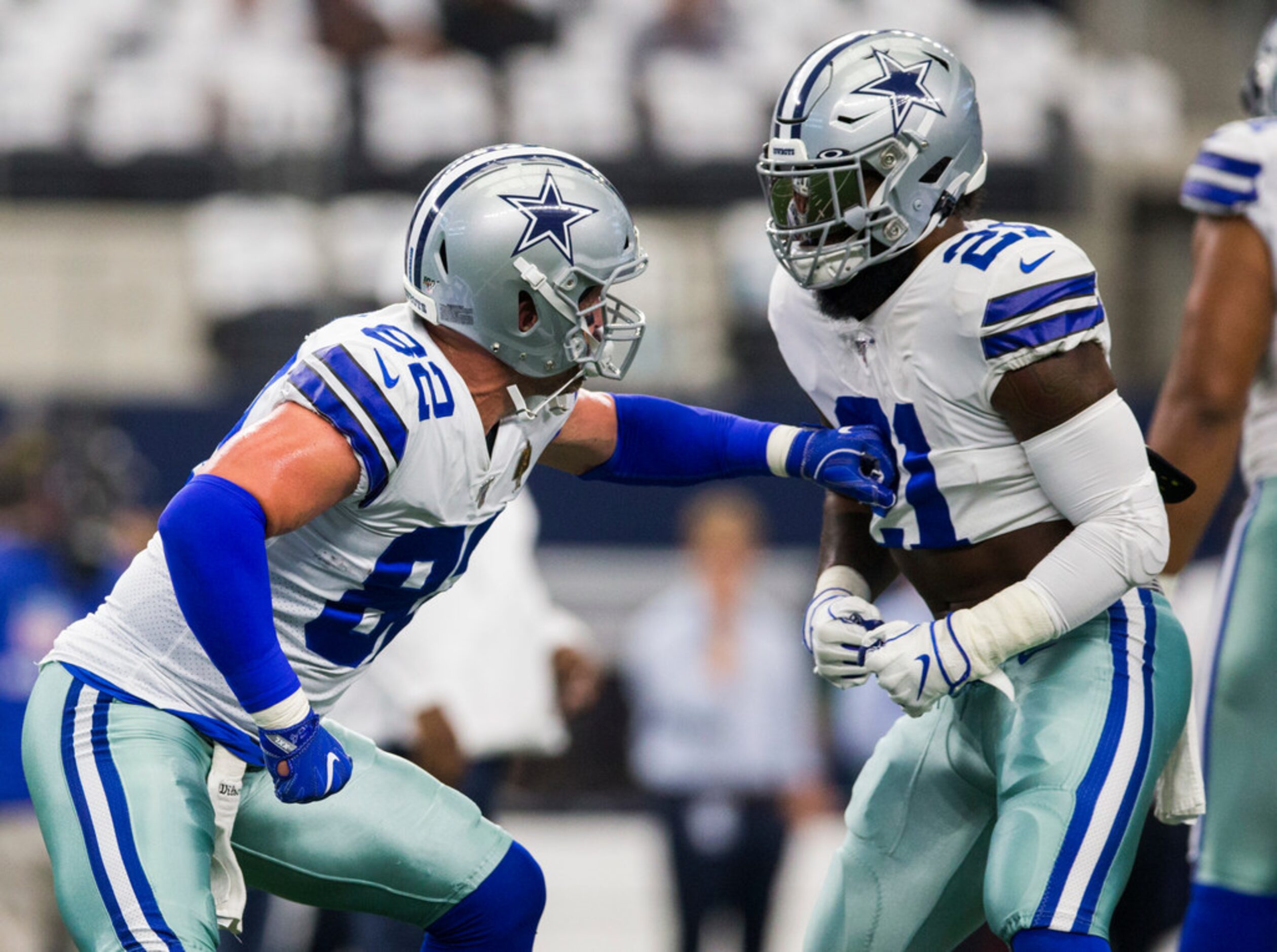 Dallas Cowboys tight end Jason Witten (82) throws a fake punch to running back Ezekiel...