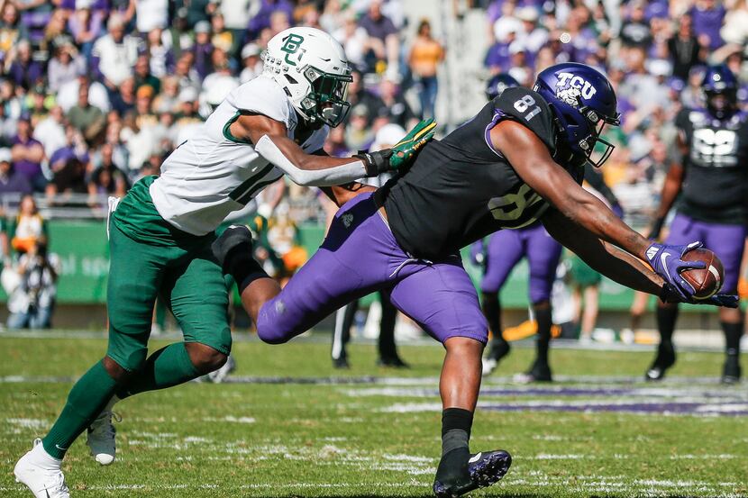 TCU Horned Frogs tight end Pro Wells (81) receives a pass as Baylor Bears cornerback Kalon...
