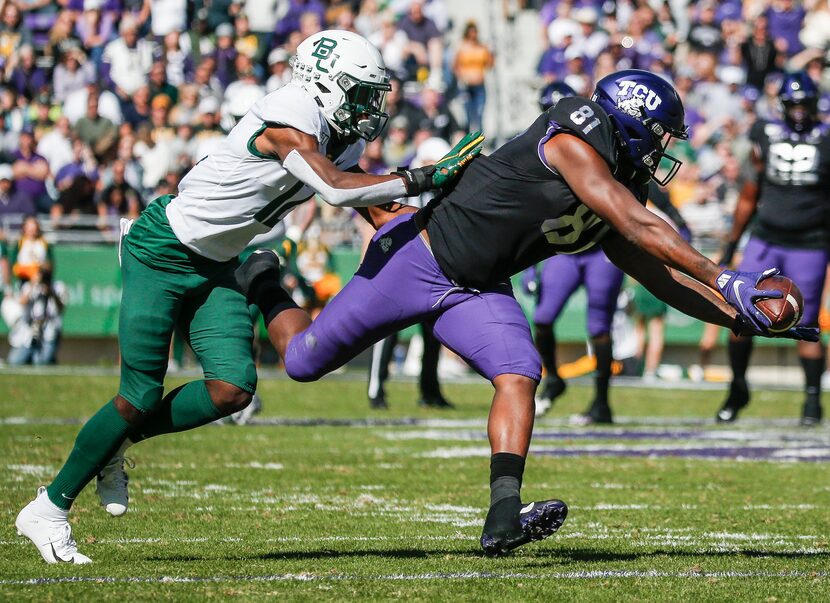 TCU Horned Frogs tight end Pro Wells (81) receives a pass as Baylor Bears cornerback Kalon...