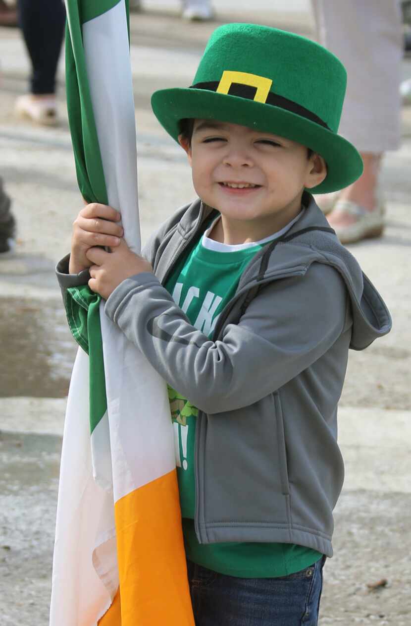 Three-year-old Evan Galvan eagerly awaits the start of the Dallas St. Patrick's Parade &...