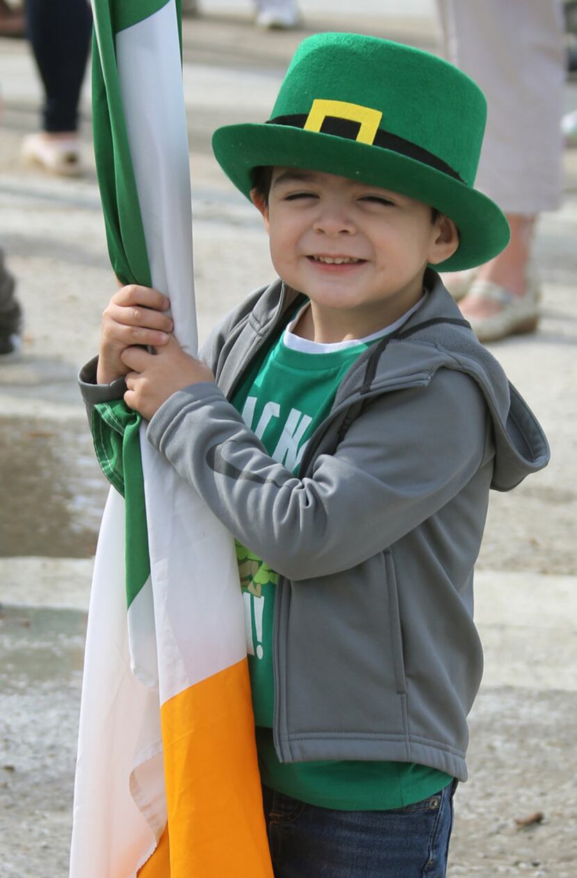 Three-year-old Evan Galvan eagerly awaits the start of the Dallas St. Patrick's Parade &...