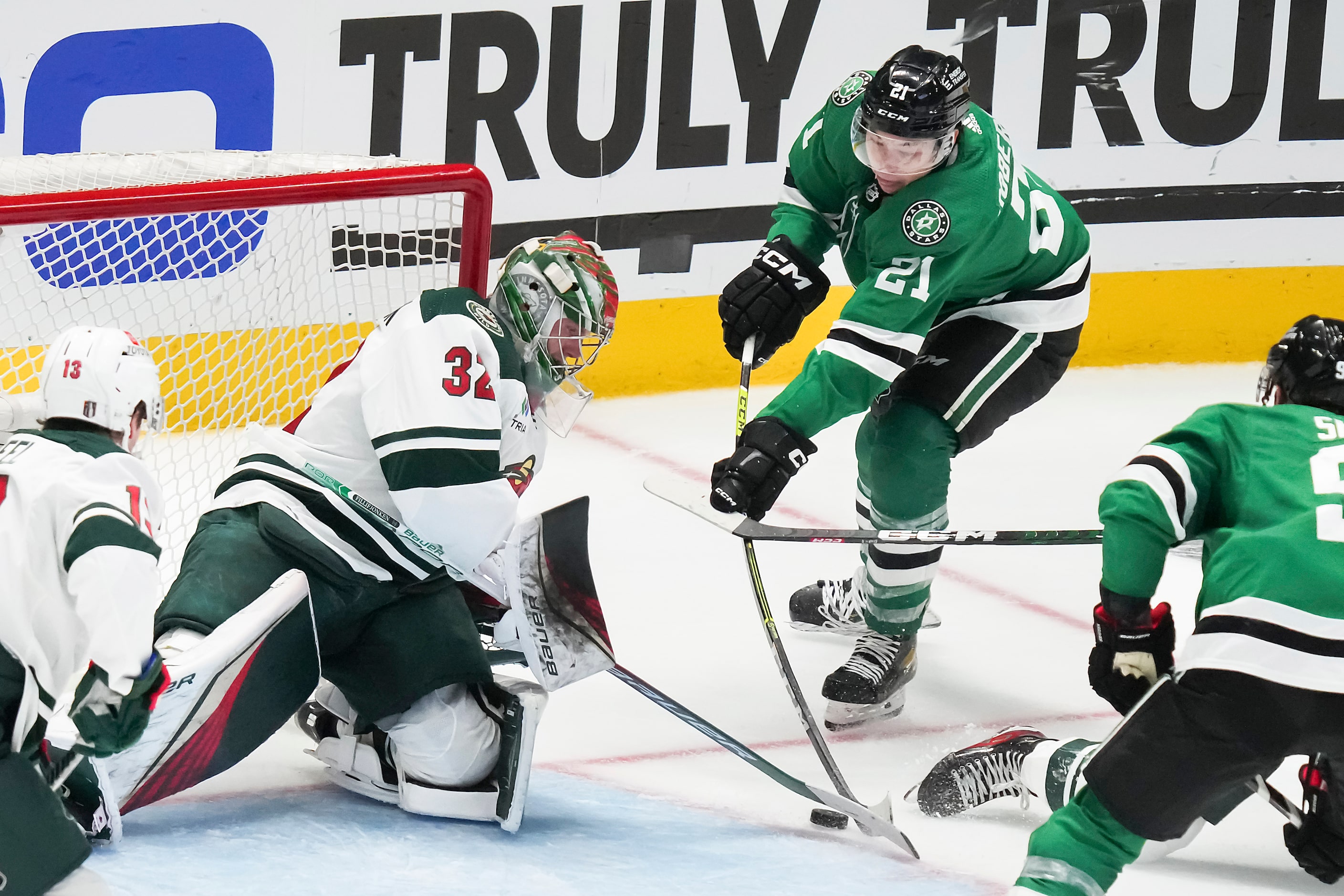 Minnesota Wild goaltender Filip Gustavsson (32) turns away Dallas Stars left wing Jason...