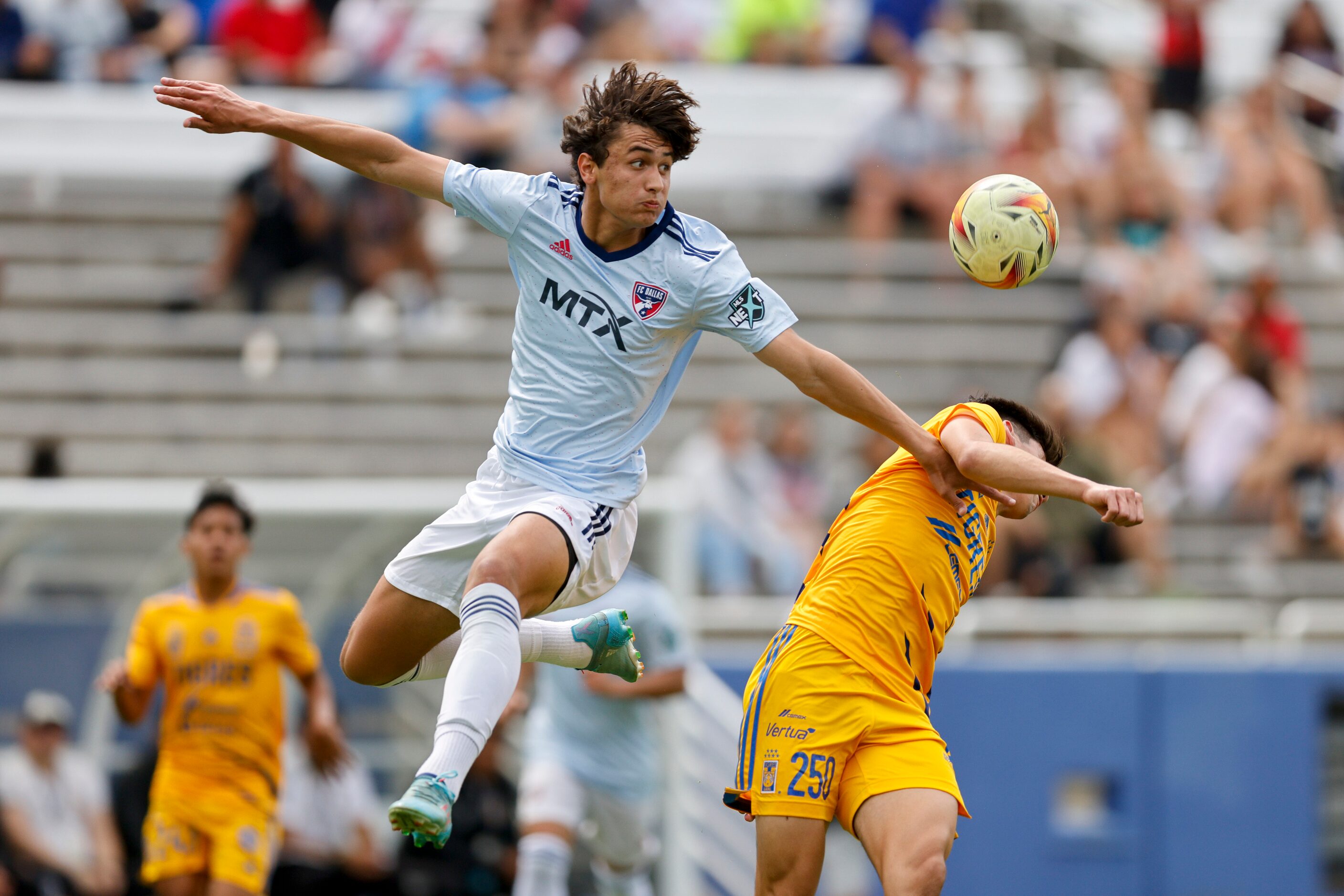 FC Dallas’ Will Baker (4) heads the ball over Tigres UANL forward Leonardo Alberto Flores...